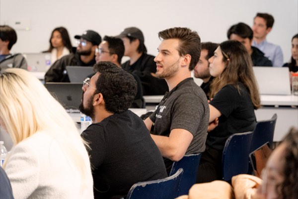 Teams listening at the AI for Good hackathon