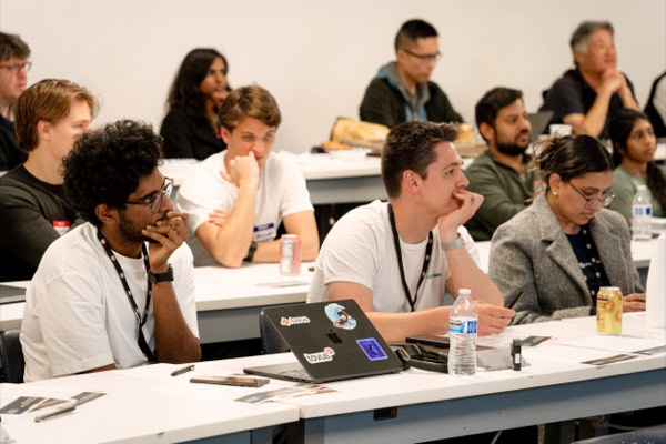 Speaker on stage at the AI for Good hackathon