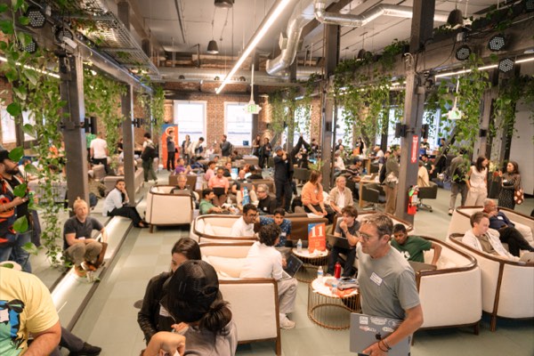 Teams across the floor at the Windsurf AI Collective hackathon